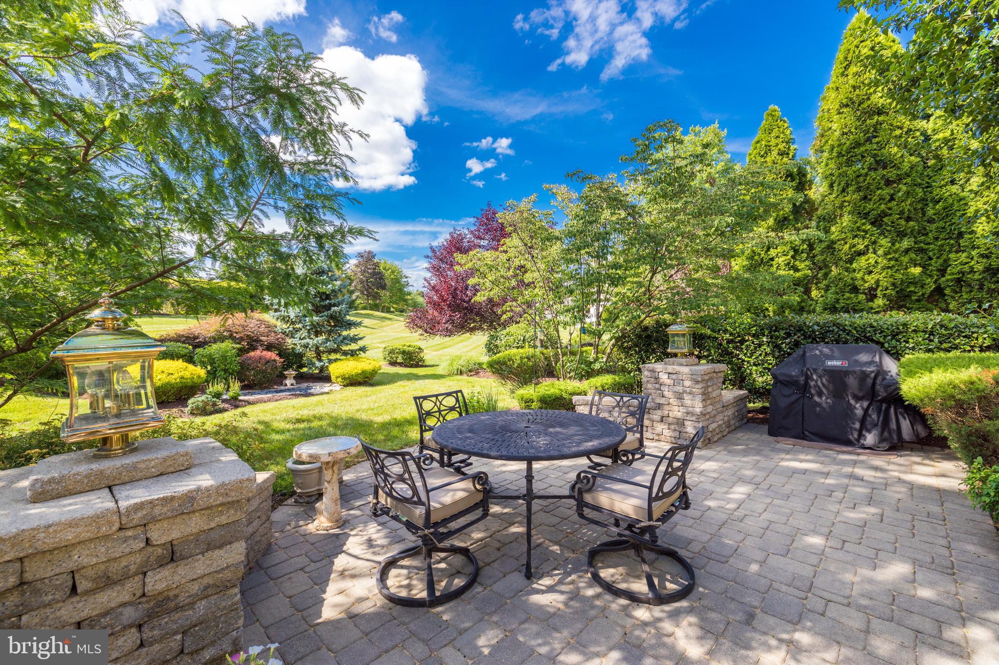 20135 Valhalla Square Ashburn, VA 20147 - Photo 32 of 41 a view of a chairs and table in a backyard