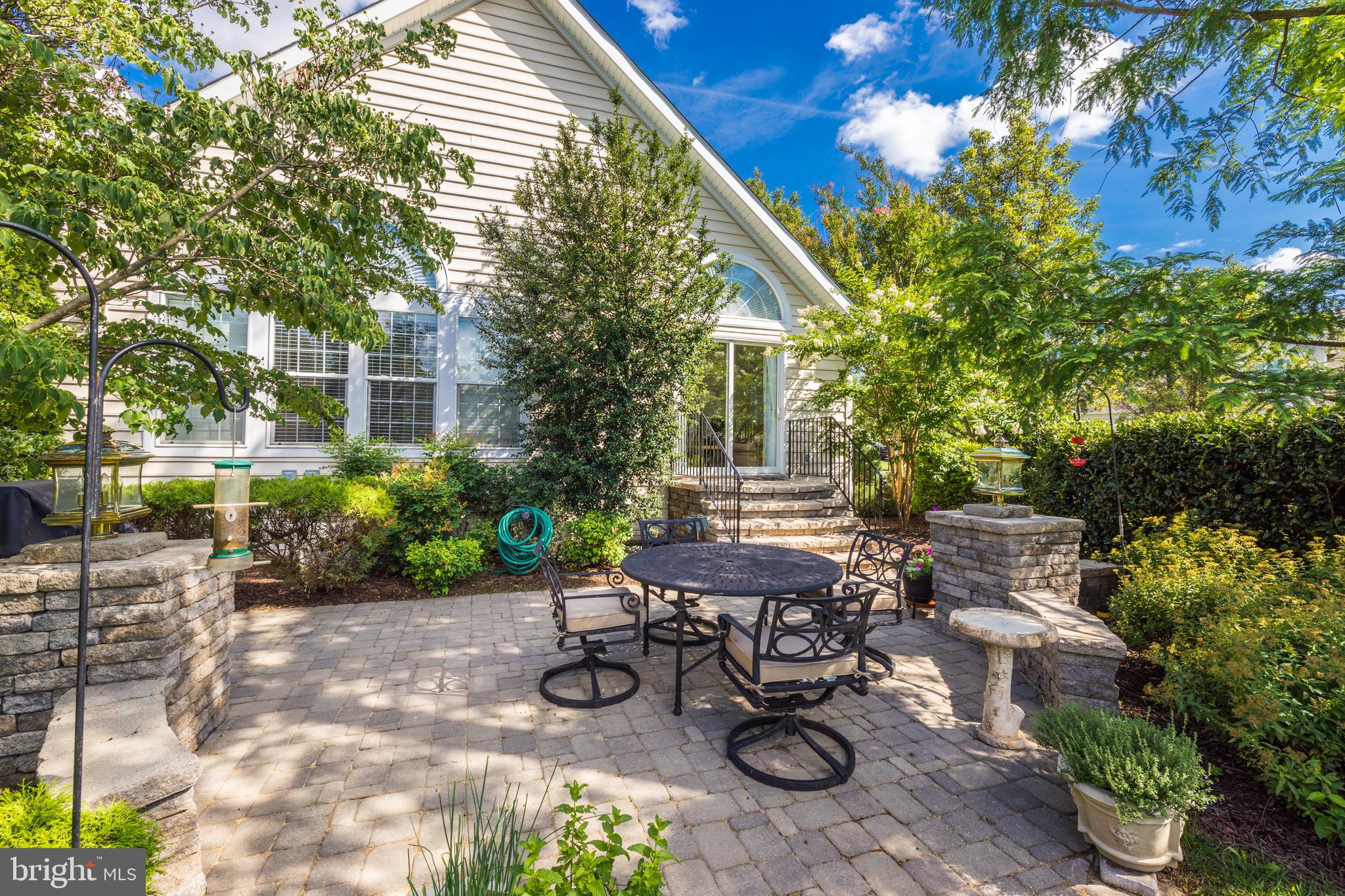 20135 Valhalla Square Ashburn, VA 20147 - Photo 33 of 41 a view of a chair and table in backyard of the house