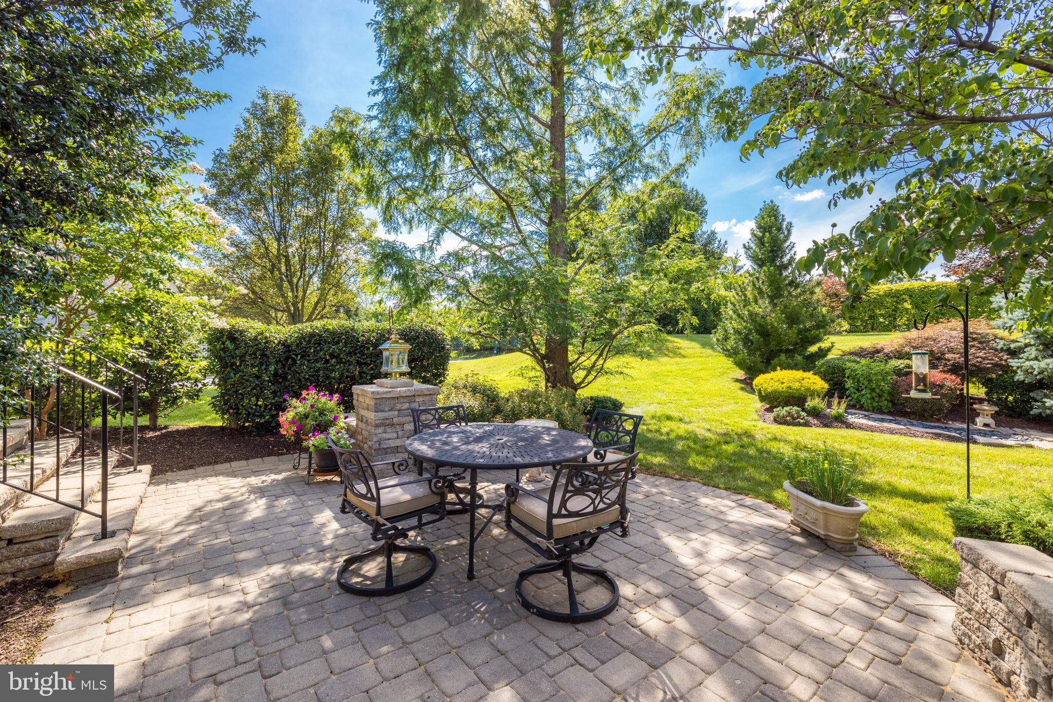 20135 Valhalla Square Ashburn, VA 20147 - Photo 35 of 41 a view of a chairs and table in backyard of the house