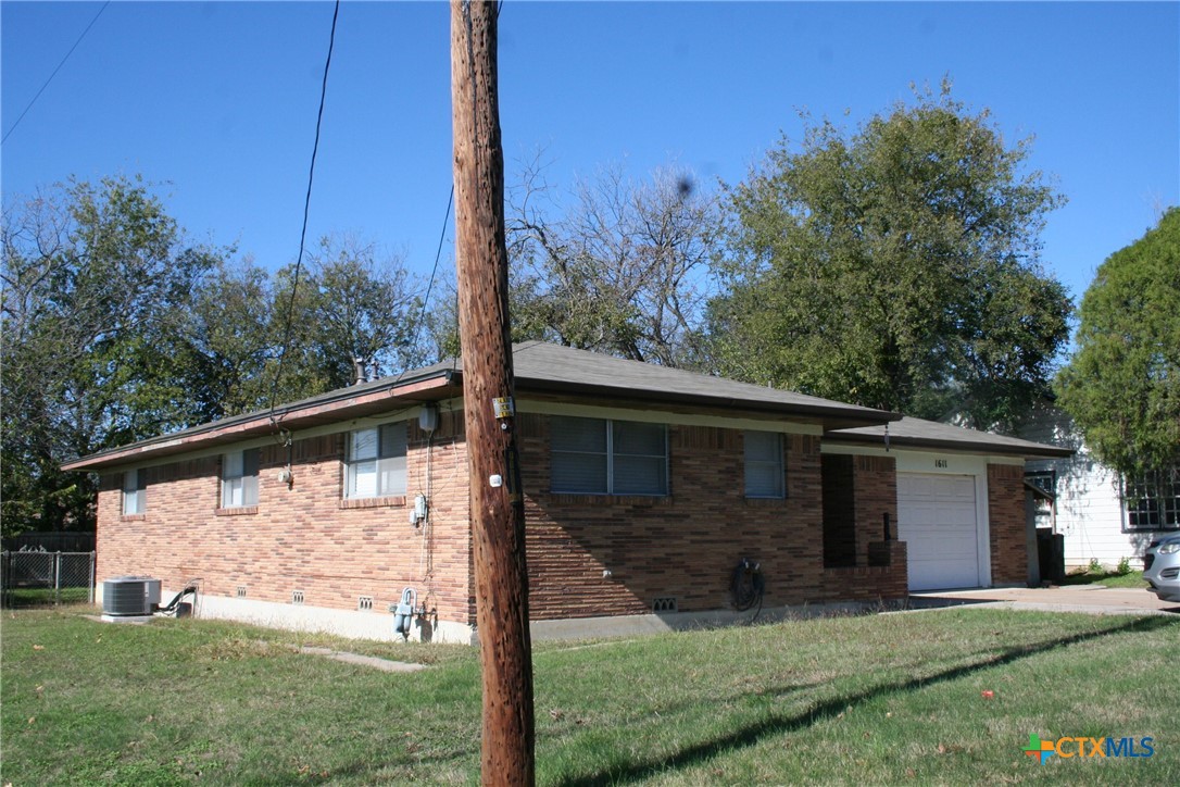 1611 North 10th Street Killeen, TX 76541 - Photo 2 of 31 a view of a backyard with plants and large trees