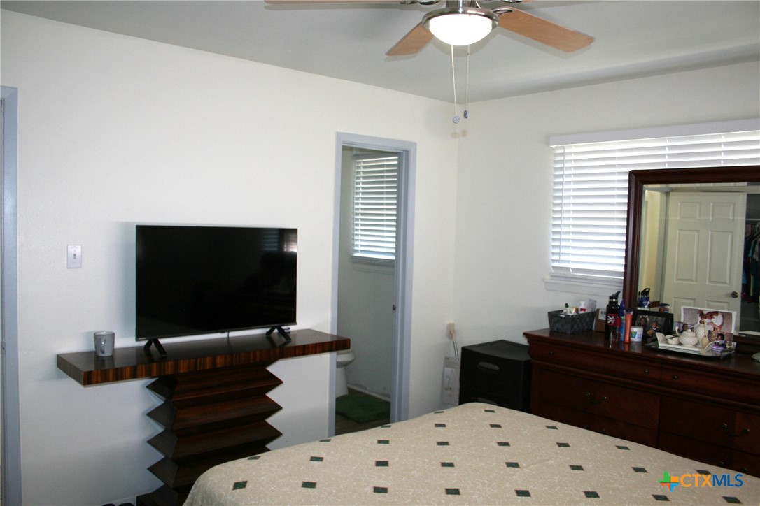 1611 North 10th Street Killeen, TX 76541 - Photo 23 of 31 a bedroom with a bed and a flat screen tv