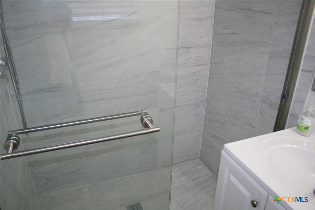 1611 North 10th Street Killeen, TX 76541 - Photo 26 of 31 a bathroom with a sink and a shower