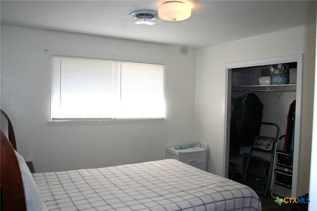 1611 North 10th Street Killeen, TX 76541 - Photo 28 of 31 a bedroom with a bed and a window