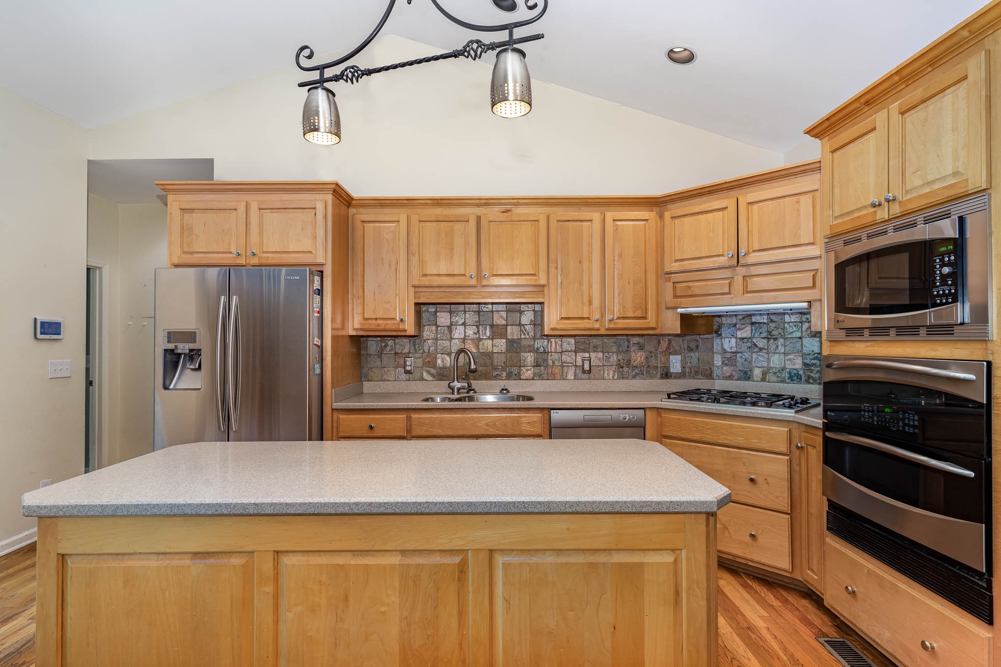 1102 Dora Whitley Road Franklin, TN 37064 - Photo 11 of 42 a kitchen with stainless steel appliances granite countertop a sink stove and refrigerator