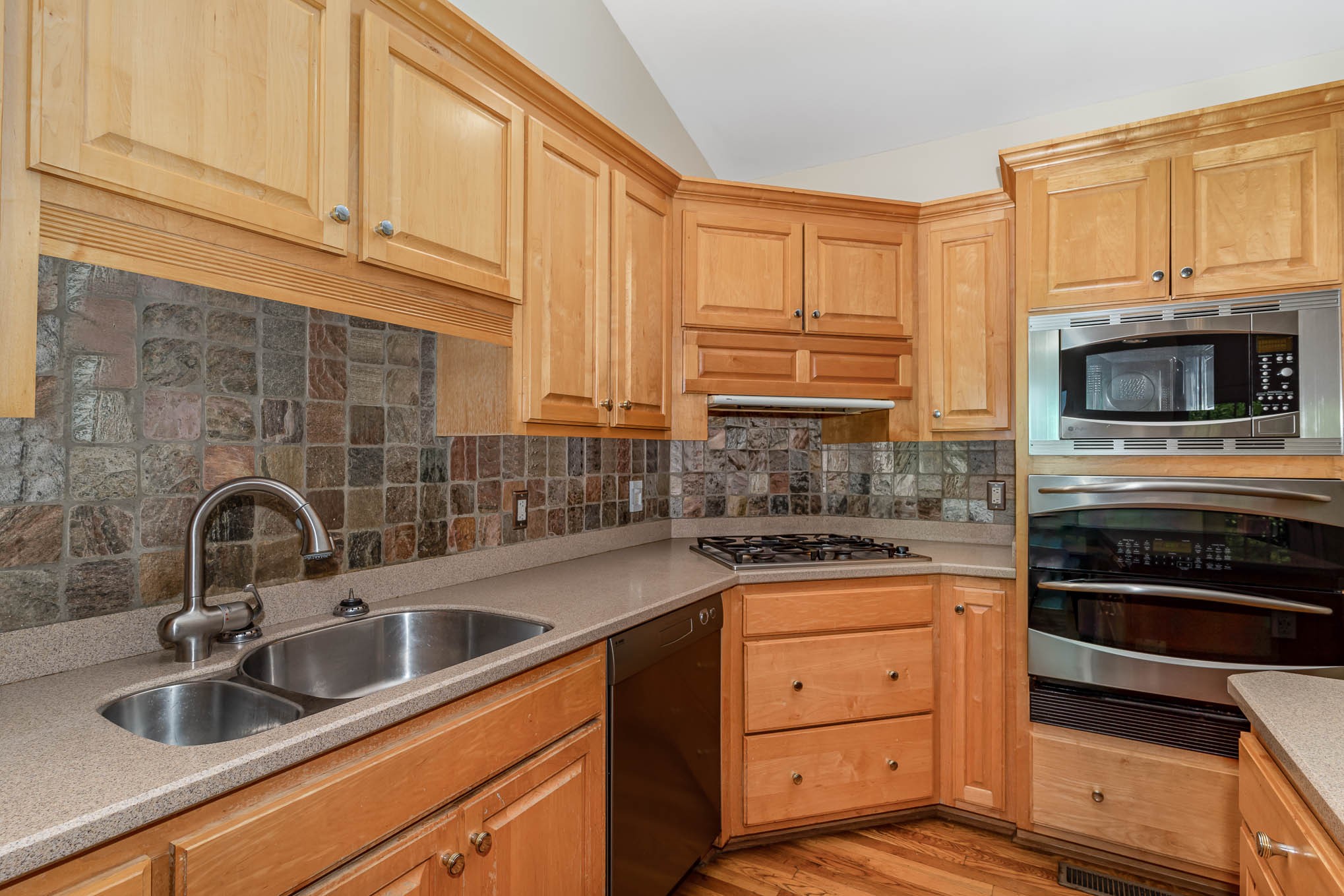 1102 Dora Whitley Road Franklin, TN 37064 - Photo 13 of 42 a kitchen with granite countertop a sink stainless steel appliances and cabinets