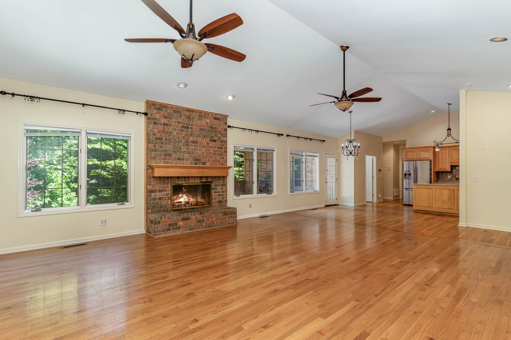 1102 Dora Whitley Road Franklin, TN 37064 - Photo 9 of 42 a view of an empty room with wooden floor fireplace and a window