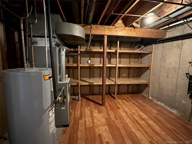 a view of a room with furniture and a fire pit