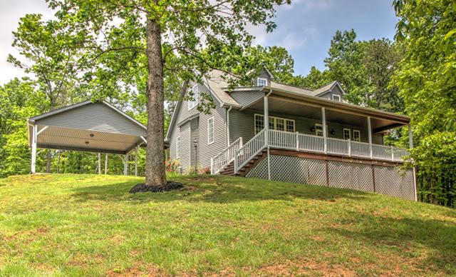 1335 Woodhaven Estates Road Blue Ridge, VA 24064 - Photo 1 of 45 a view of a house with yard and sitting area