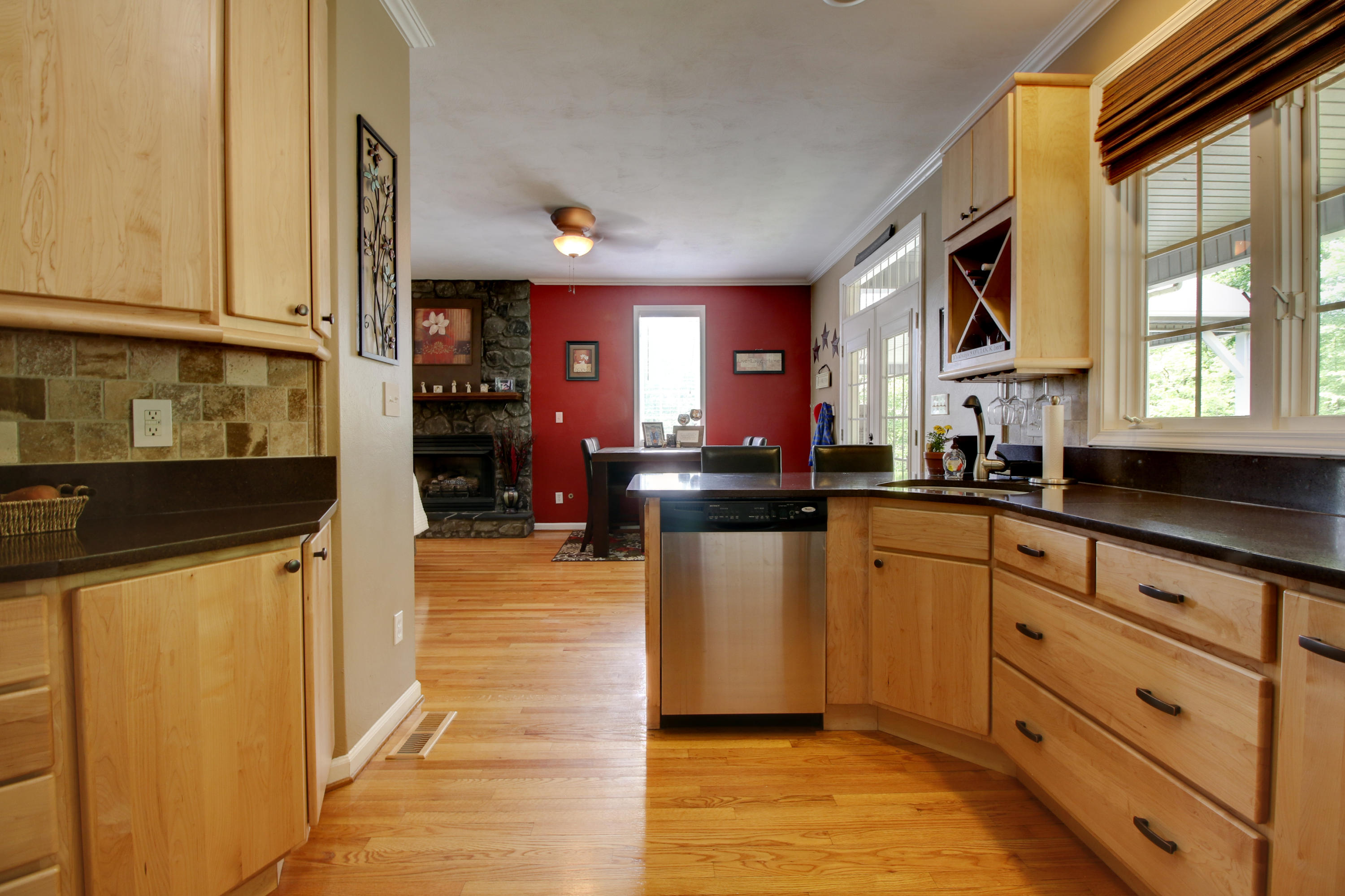 1335 Woodhaven Estates Road Blue Ridge, VA 24064 - Photo 11 of 45 a kitchen with stainless steel appliances granite countertop a stove a sink and a refrigerator
