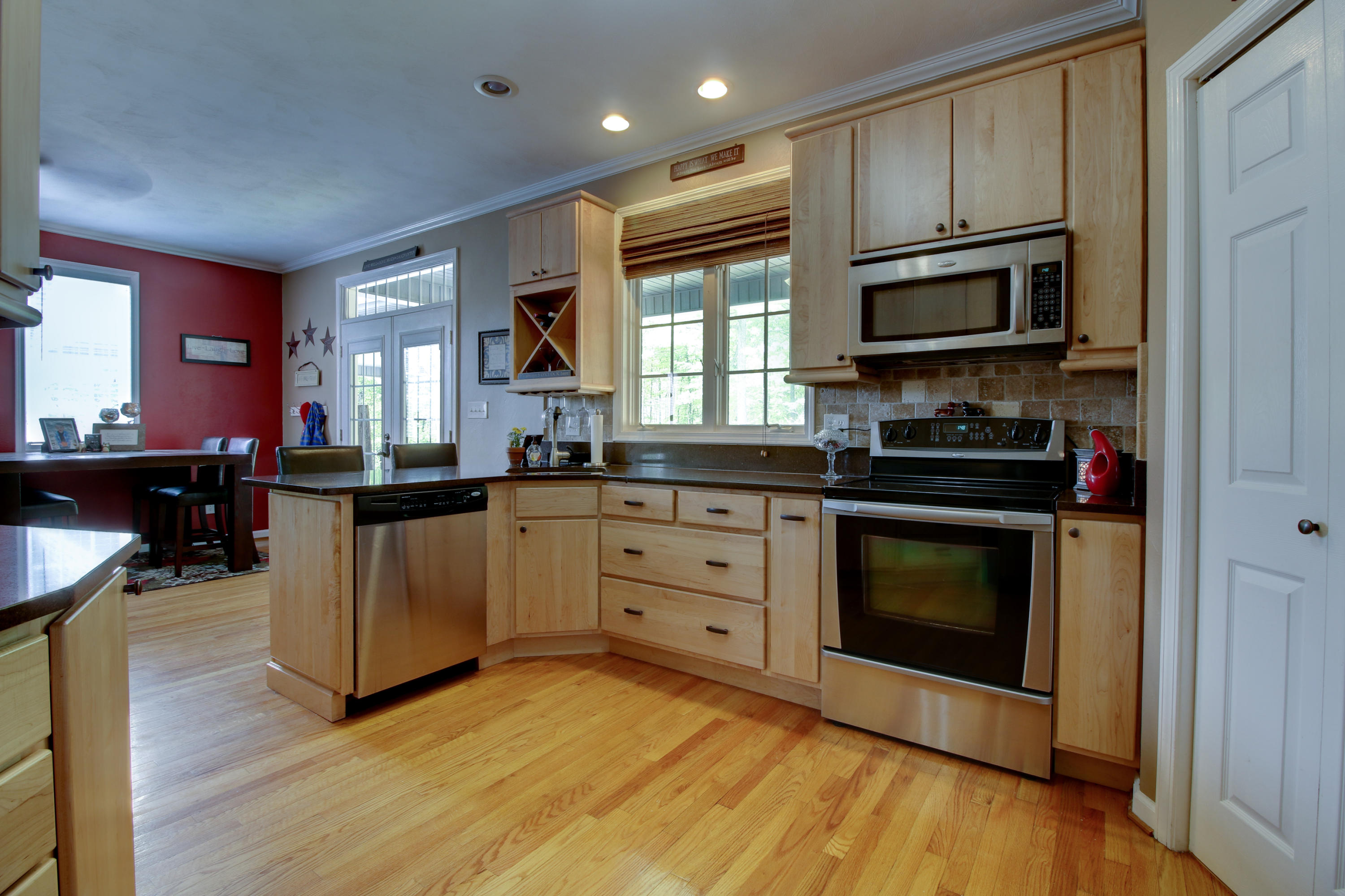 1335 Woodhaven Estates Road Blue Ridge, VA 24064 - Photo 12 of 45 a kitchen with stainless steel appliances granite countertop a stove a sink and a microwave