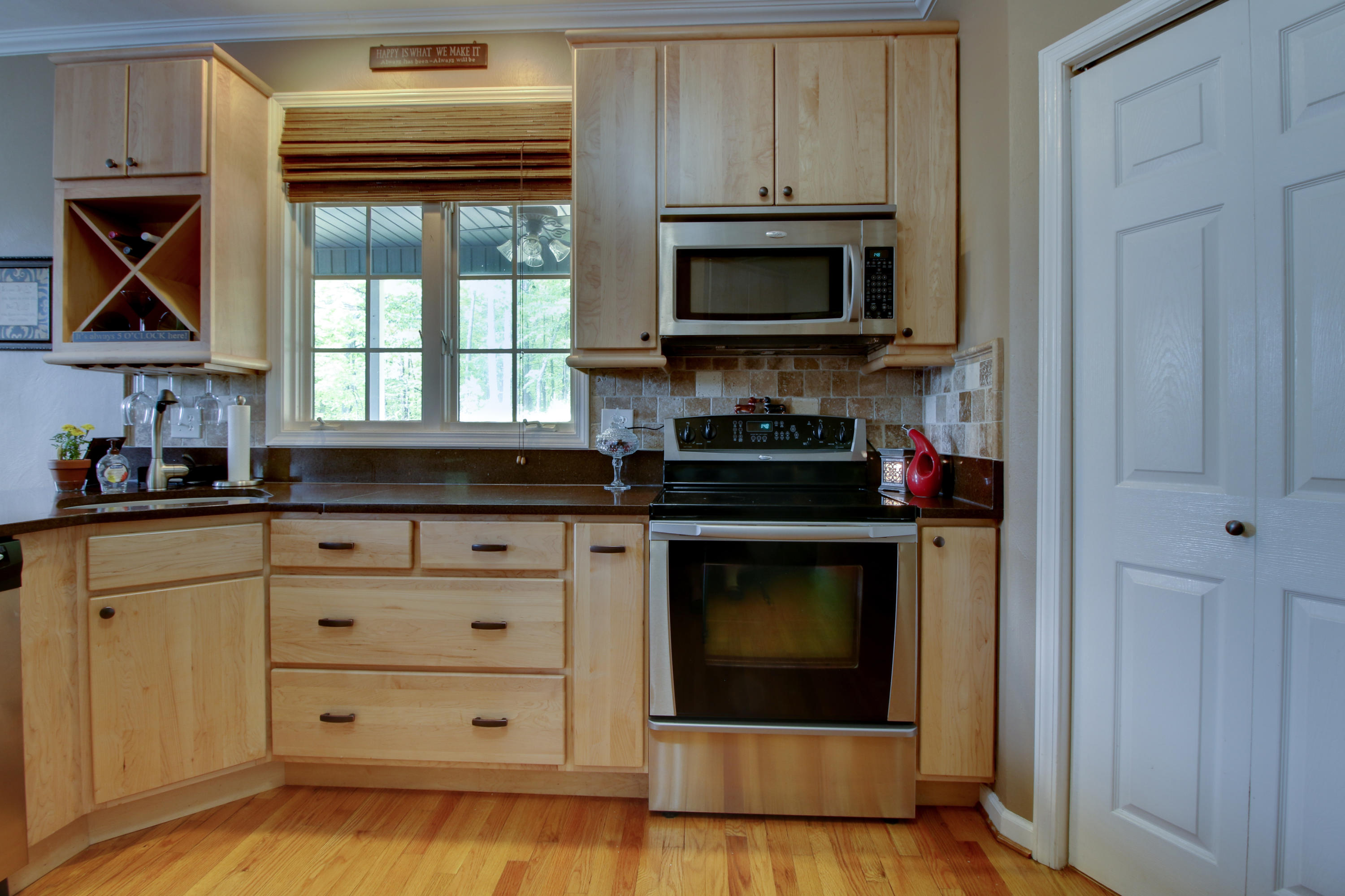 1335 Woodhaven Estates Road Blue Ridge, VA 24064 - Photo 13 of 45 a kitchen with stainless steel appliances white cabinets and a stove top oven