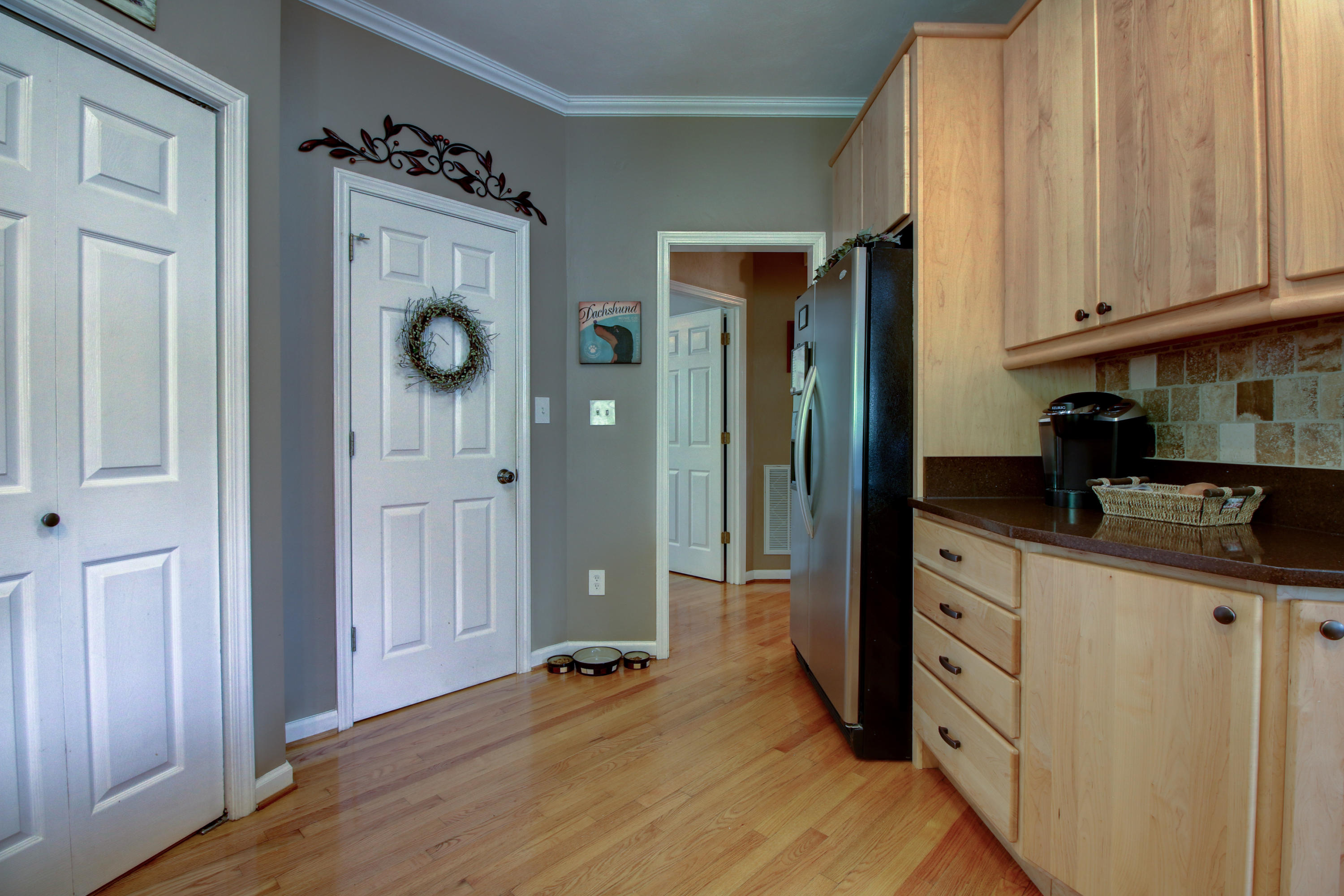 1335 Woodhaven Estates Road Blue Ridge, VA 24064 - Photo 14 of 45 a kitchen with granite countertop a refrigerator and a stove top oven