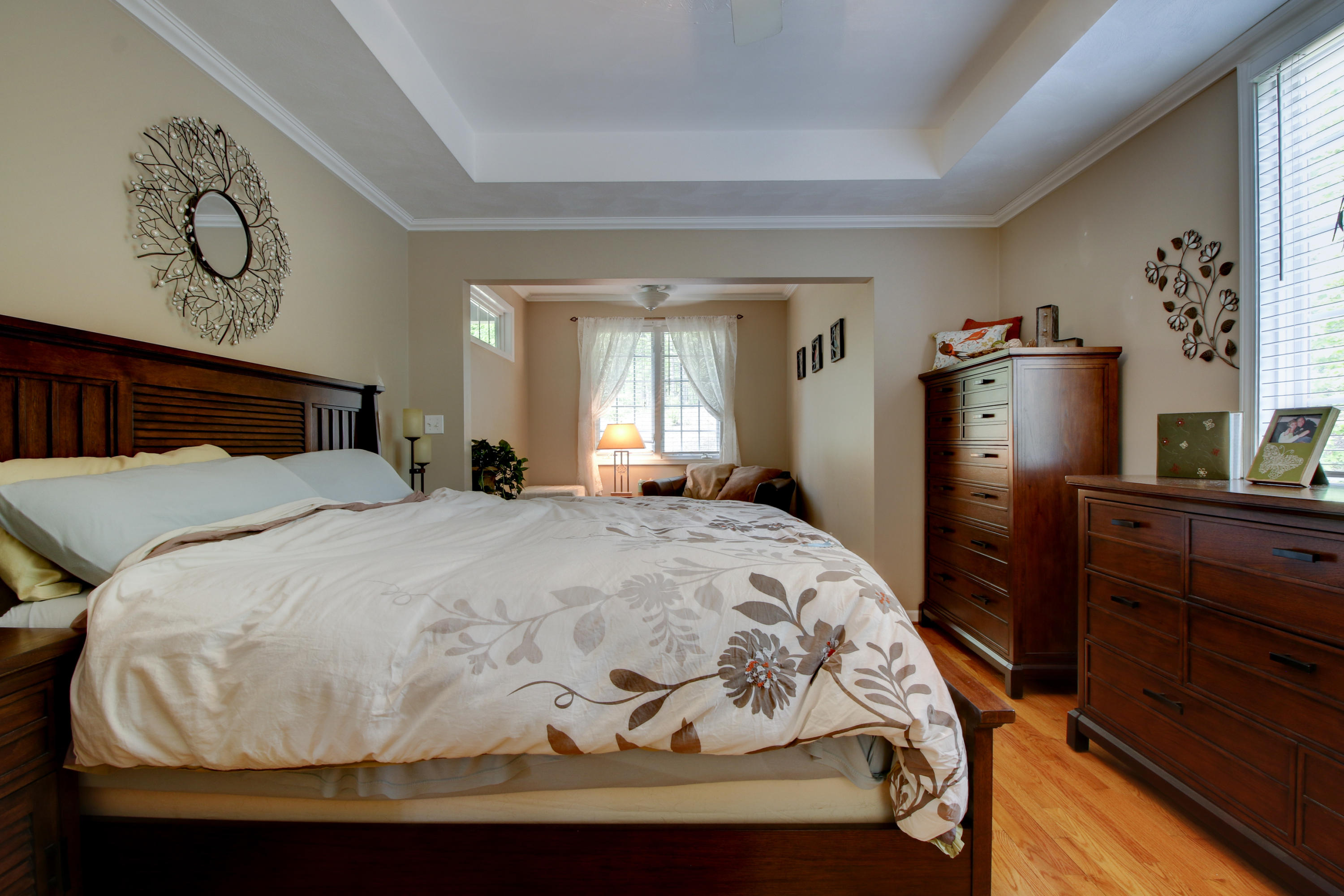 1335 Woodhaven Estates Road Blue Ridge, VA 24064 - Photo 22 of 45 a bedroom with a bed and dresser with mirror