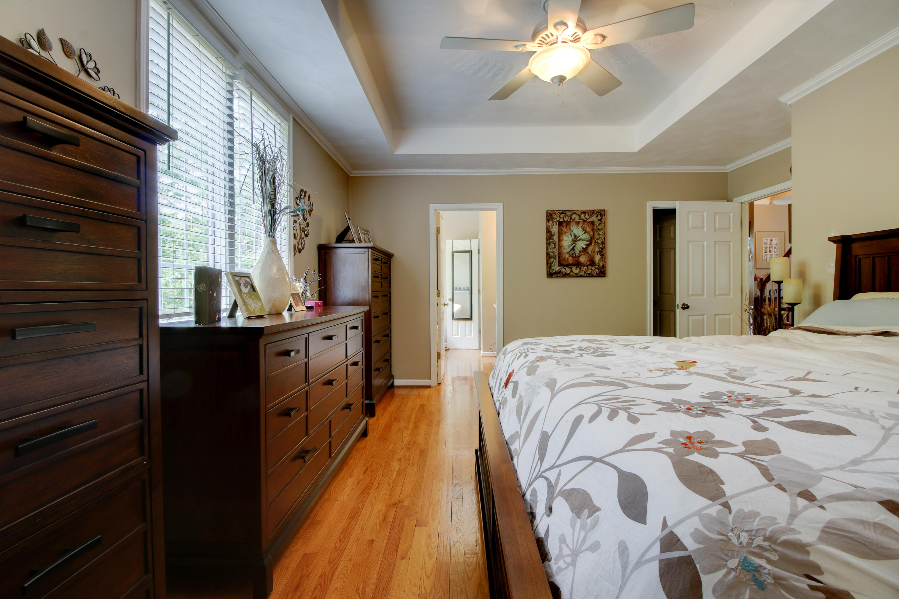 1335 Woodhaven Estates Road Blue Ridge, VA 24064 - Photo 23 of 45 a bed room with a bed and a chandelier