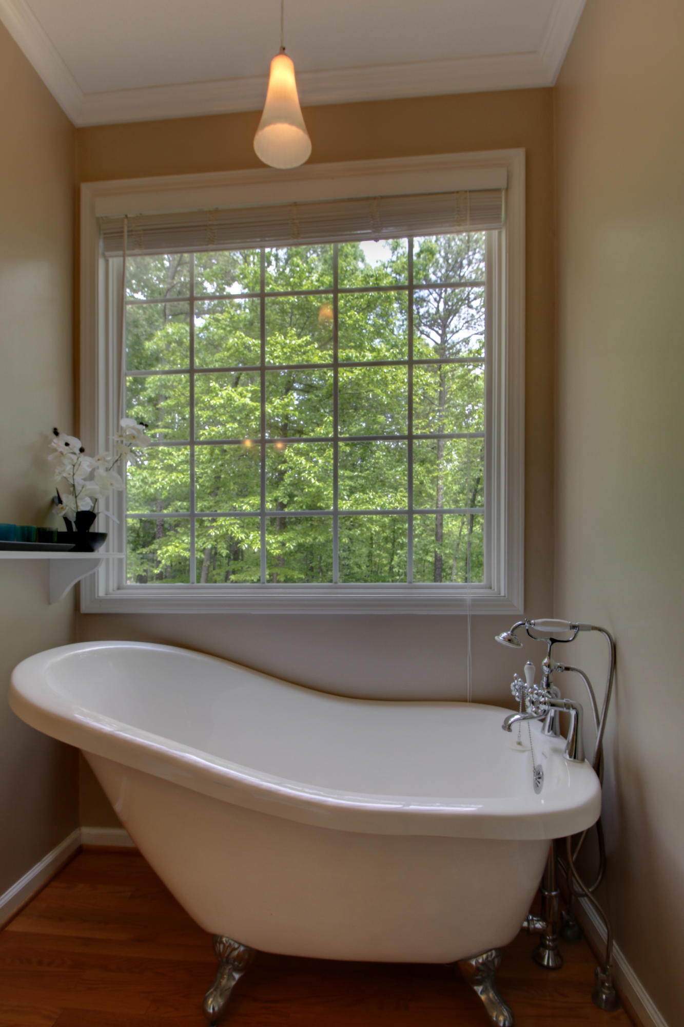 1335 Woodhaven Estates Road Blue Ridge, VA 24064 - Photo 27 of 45 a bath tub sitting in a bathroom next to a window