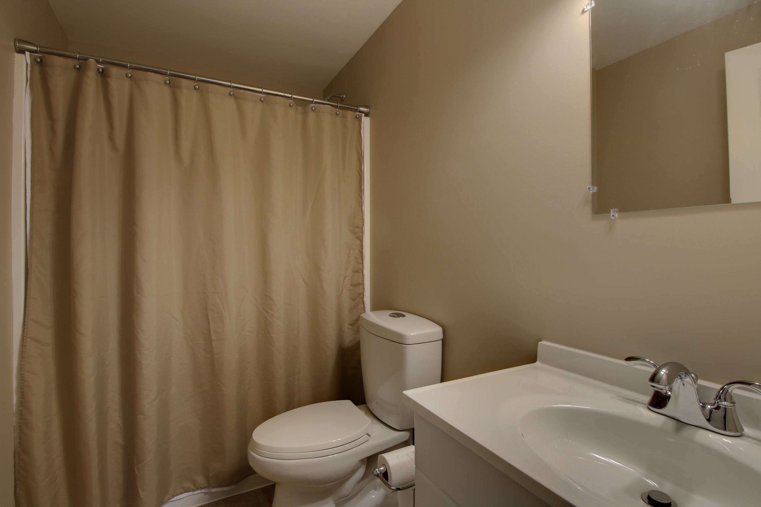 1335 Woodhaven Estates Road Blue Ridge, VA 24064 - Photo 36 of 45 a bathroom with a sink and a toilet