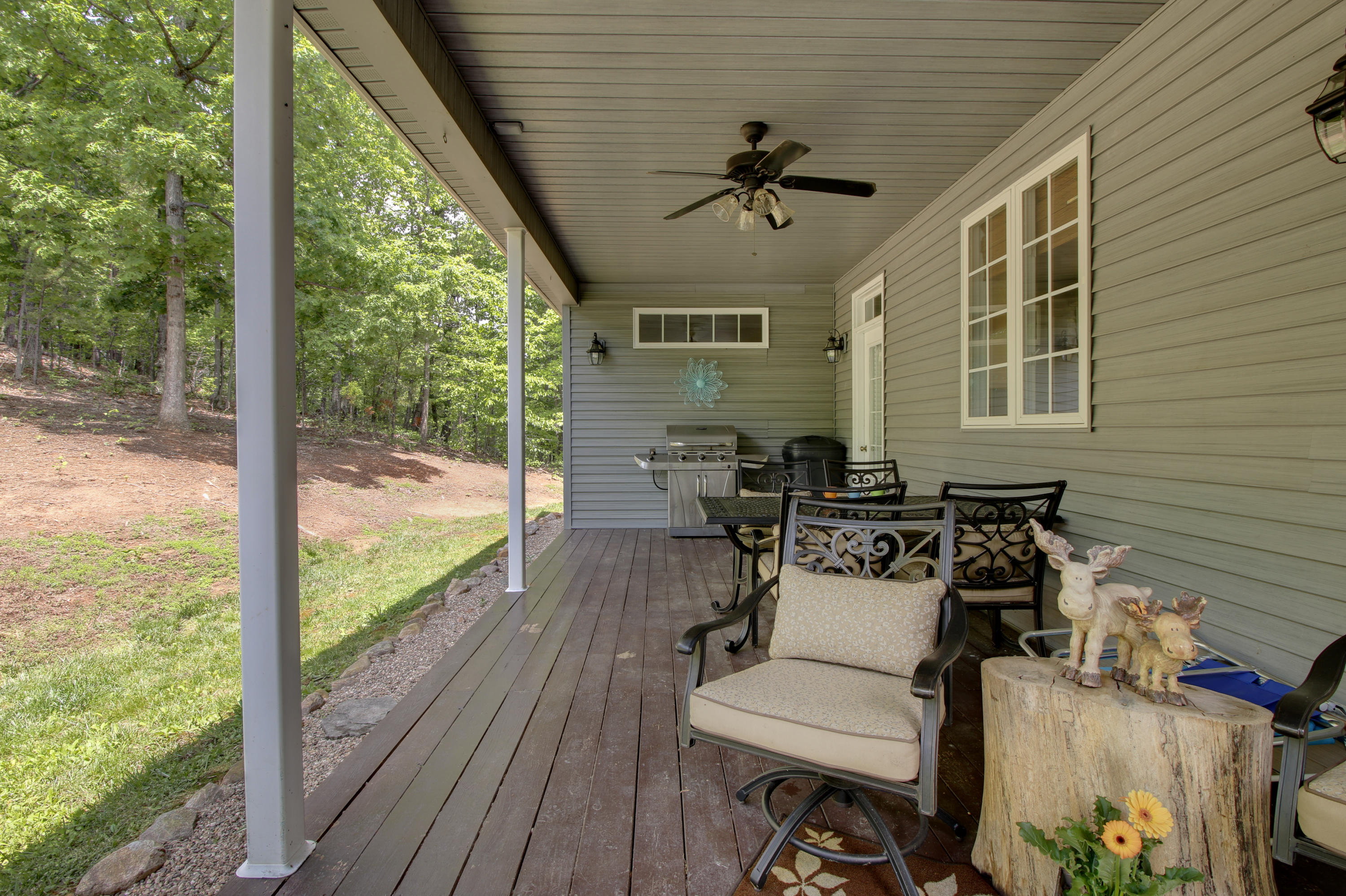 1335 Woodhaven Estates Road Blue Ridge, VA 24064 - Photo 39 of 45 a view of a porch with furniture and wooden floor