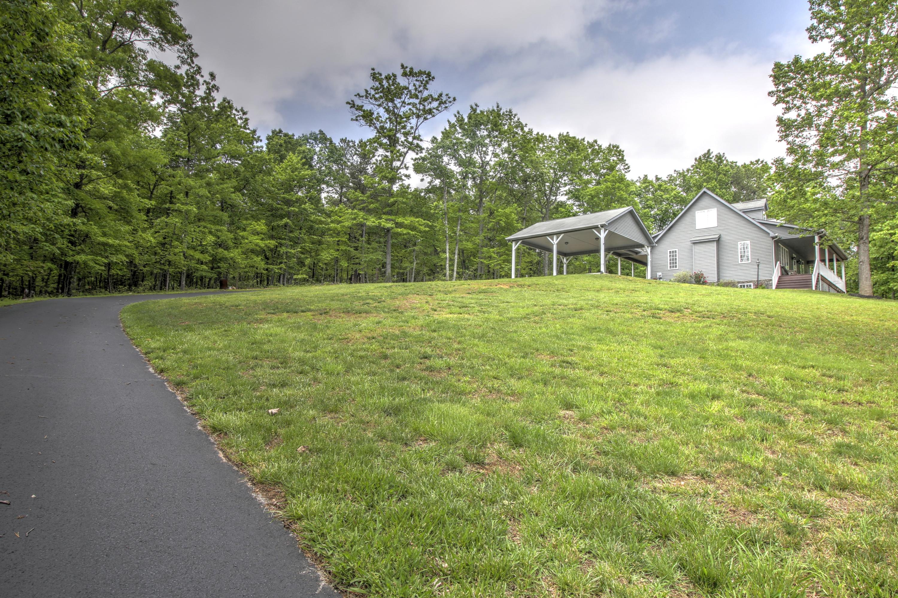 1335 Woodhaven Estates Road Blue Ridge, VA 24064 - Photo 5 of 45 a front view of a house with a yard