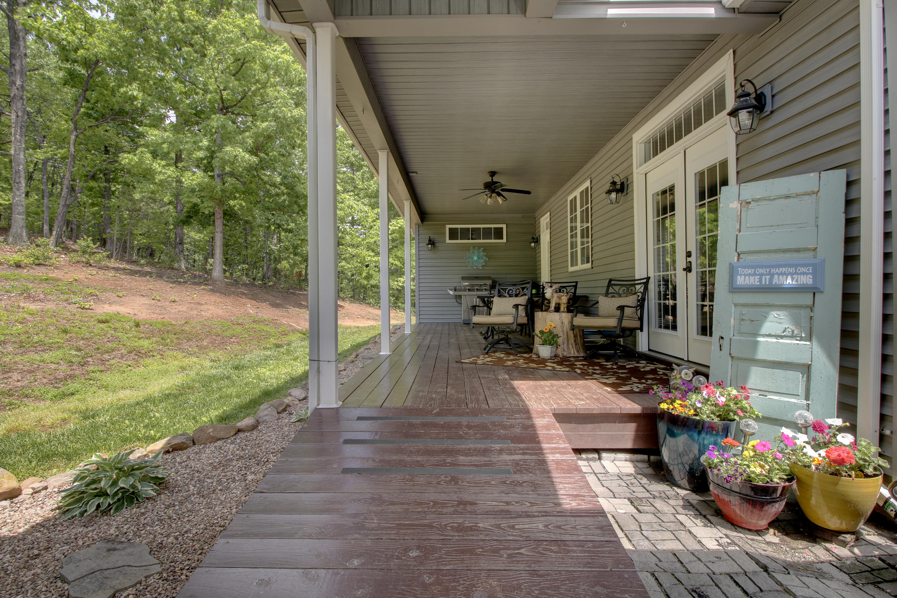 1335 Woodhaven Estates Road Blue Ridge, VA 24064 - Photo 41 of 45 a view of a patio with table and chairs potted plants with wooden floor