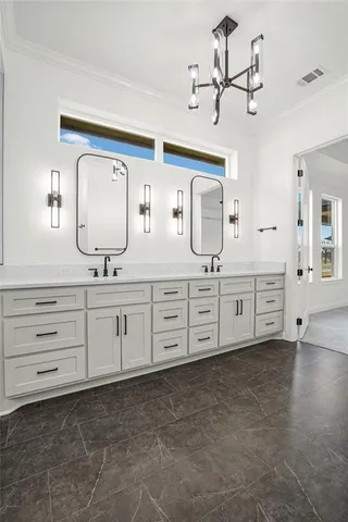 a bathroom with a sink a toilet and mirror