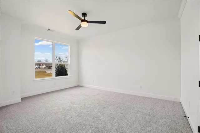 a bathroom with a granite countertop sink a toilet and a mirror