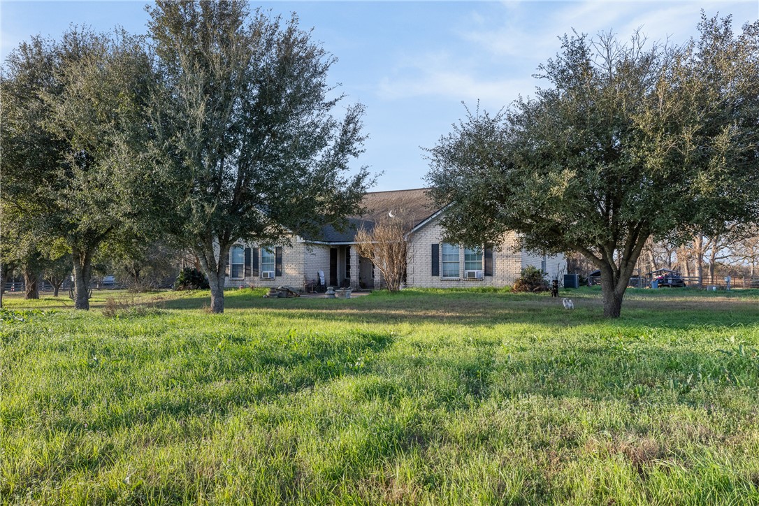 24248 State Highway Navasota, TX 77868 - Photo 5 of 18 a front view of a house with a yard