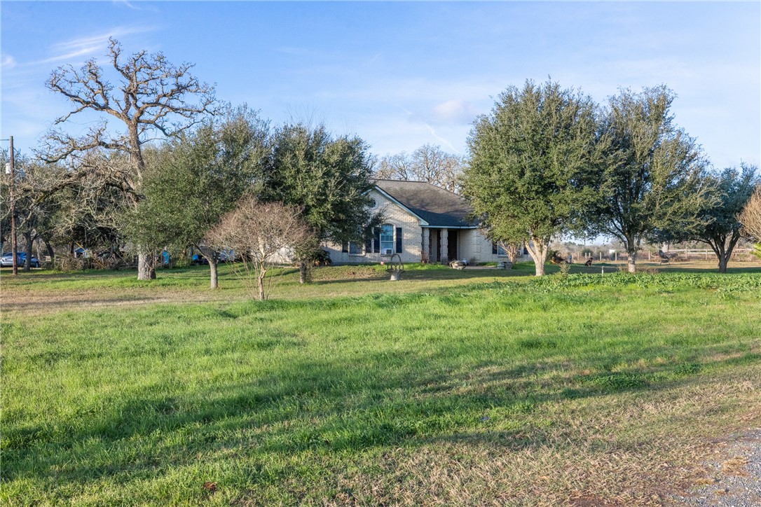 24248 State Highway Navasota, TX 77868 - Photo 7 of 18 a front view of a house with garden