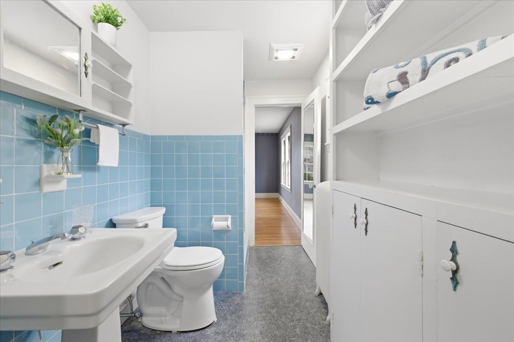 238 Harris Avenue Needham, MA 02492 - Photo 21 of 35 a bathroom with a sink and mirror with toilet