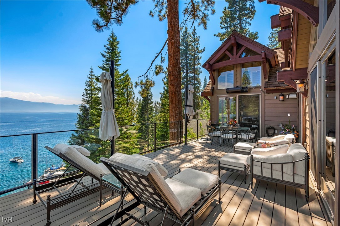 444 Gonowabie Road Crystal Bay, NV 89402 - Photo 14 of 50 a view of a patio with table and chairs and potted plants