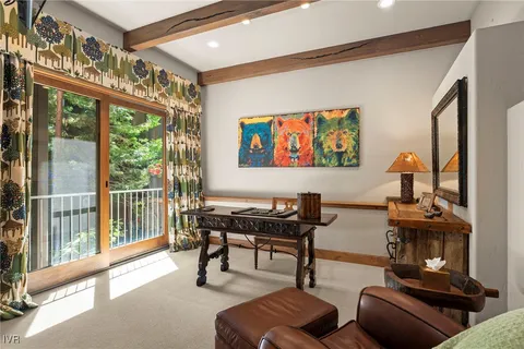 a bathroom with a granite countertop sink a toilet and shower