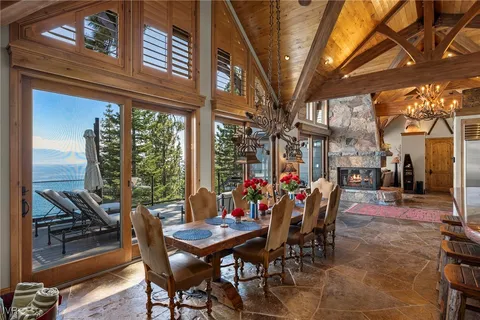 a view of a dining table and chairs in the patio