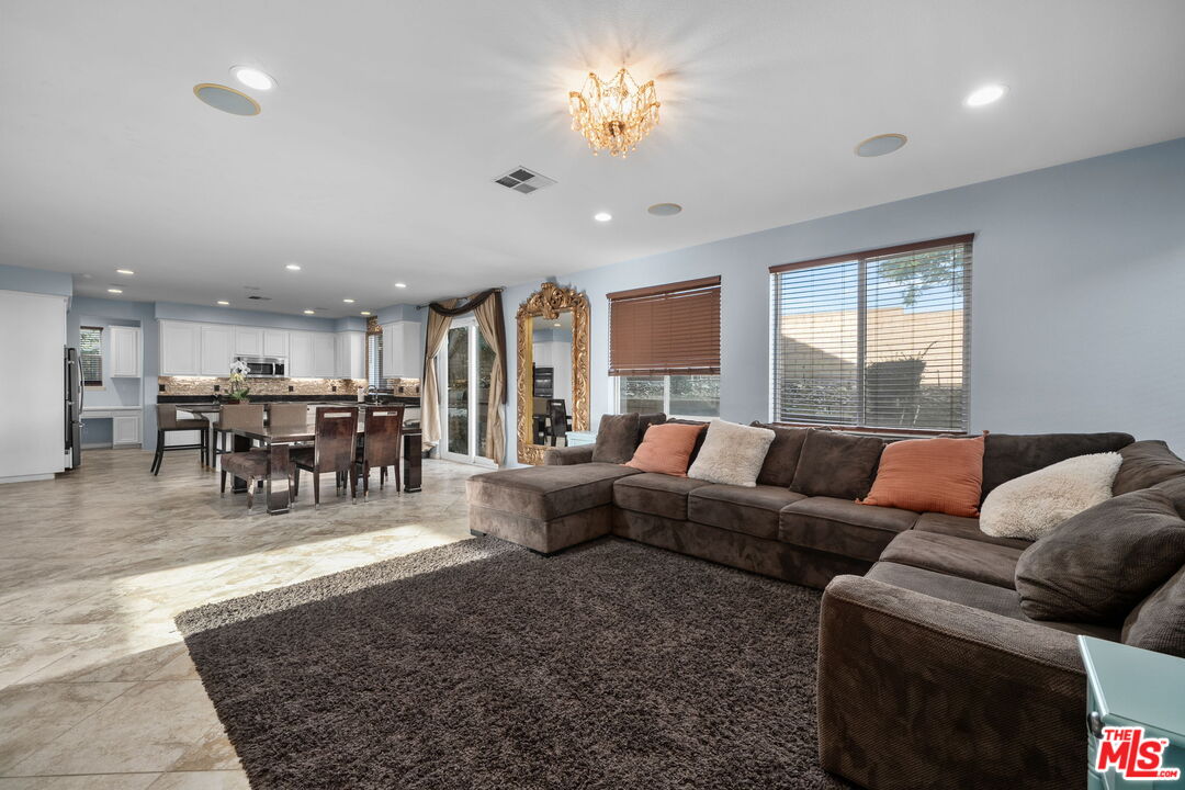 18080 Tanzanite Road San Bernardino, CA 92407 - Photo 12 of 49 a living room with furniture and a large window