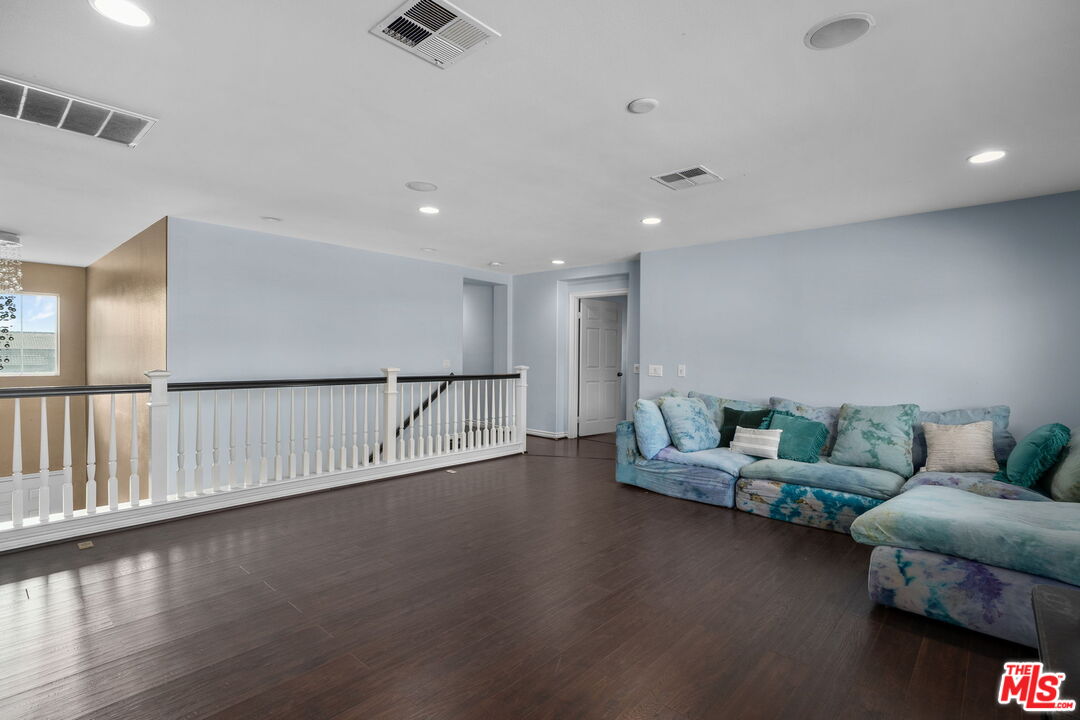 18080 Tanzanite Road San Bernardino, CA 92407 - Photo 22 of 49 a living room with furniture and wooden floor