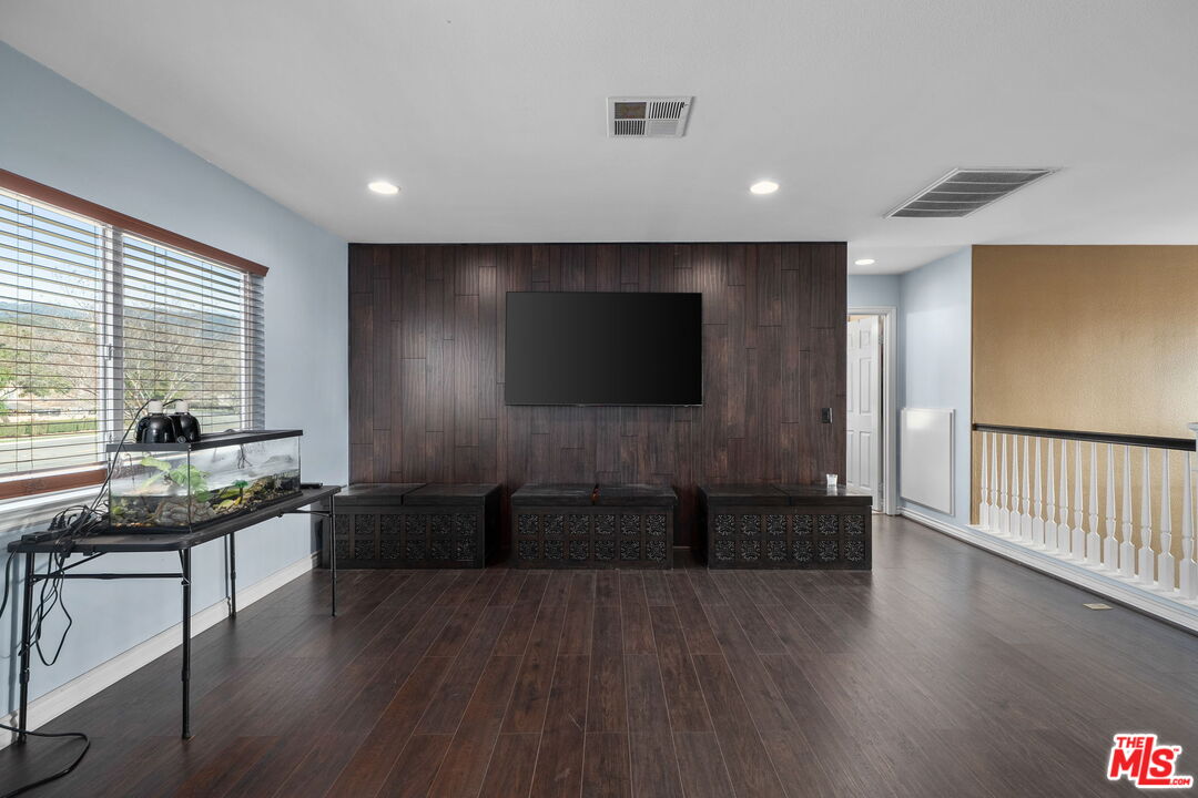 18080 Tanzanite Road San Bernardino, CA 92407 - Photo 23 of 49 a livingroom with furniture wooden floor and window