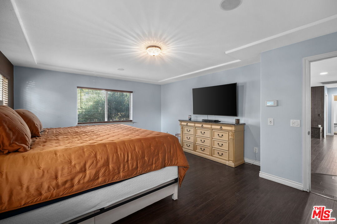 18080 Tanzanite Road San Bernardino, CA 92407 - Photo 25 of 49 a bed room with a bed television and a large window