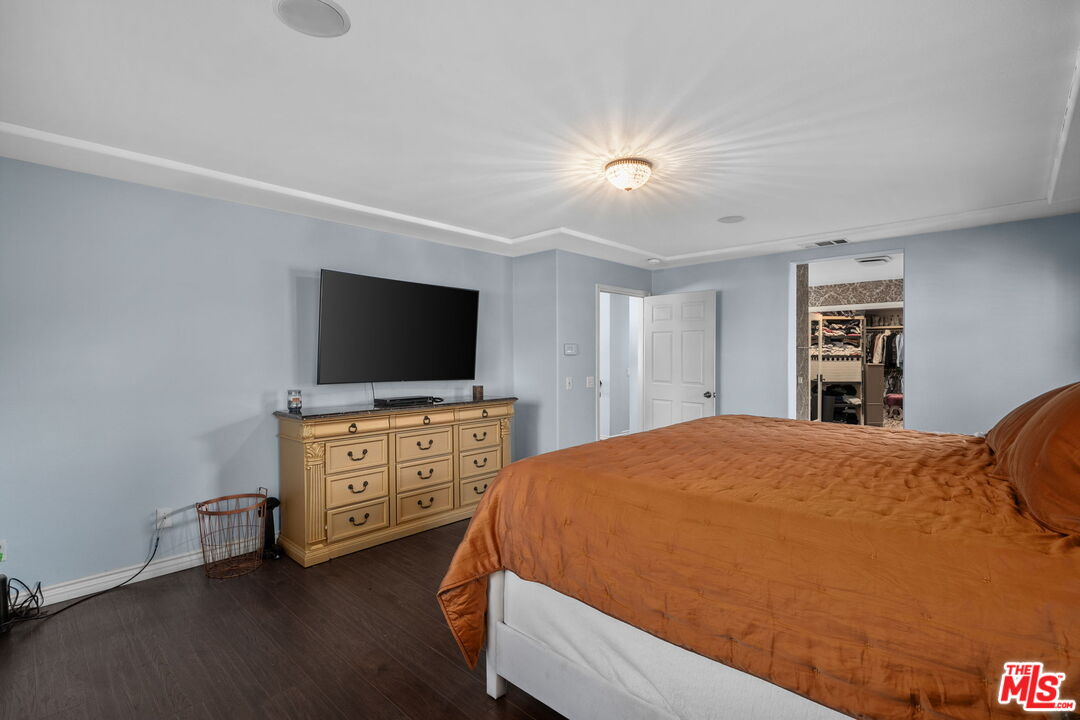 18080 Tanzanite Road San Bernardino, CA 92407 - Photo 26 of 49 a bedroom with a bed and a flat screen tv