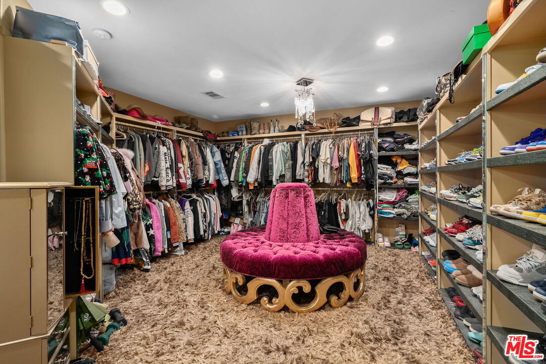 18080 Tanzanite Road San Bernardino, CA 92407 - Photo 30 of 49 a view of a storage room with a lot of stuff