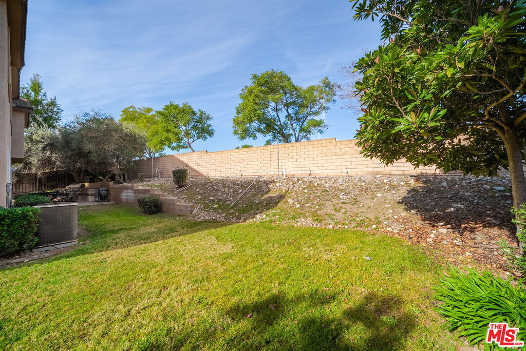 18080 Tanzanite Road San Bernardino, CA 92407 - Photo 34 of 49 a view of a yard with an trees