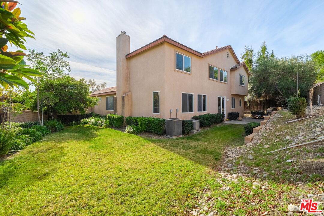 18080 Tanzanite Road San Bernardino, CA 92407 - Photo 35 of 49 a front view of house with yard and green space
