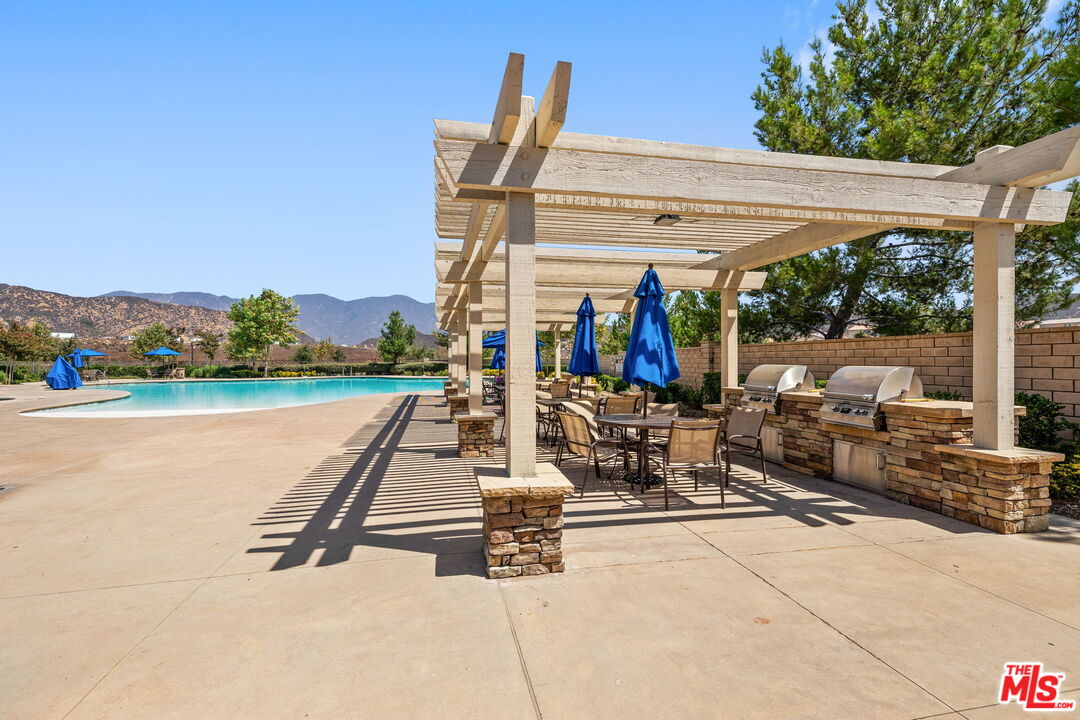 18080 Tanzanite Road San Bernardino, CA 92407 - Photo 47 of 49 a view of a patio with a table and chairs