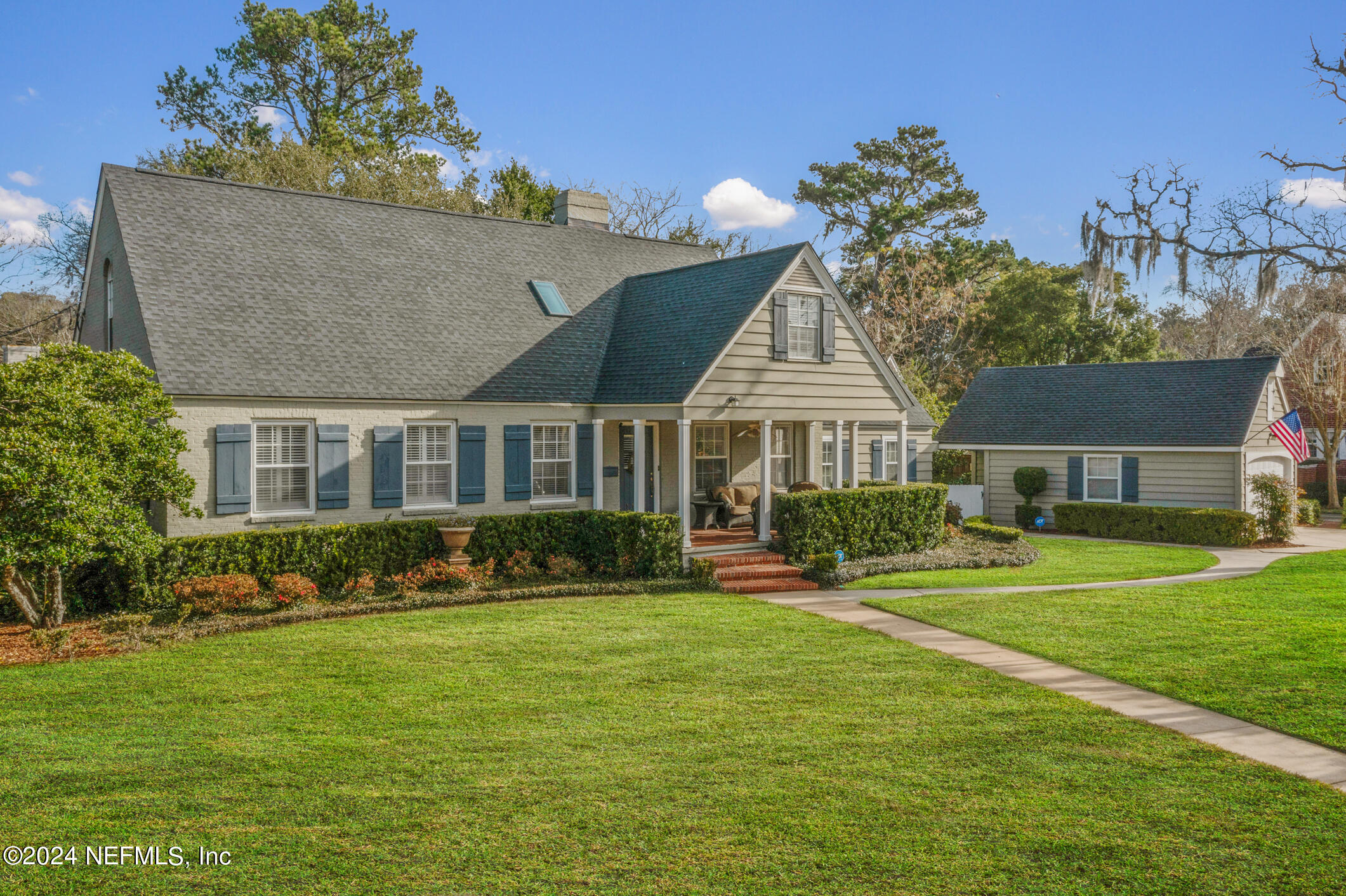 a front view of house with yard and green space