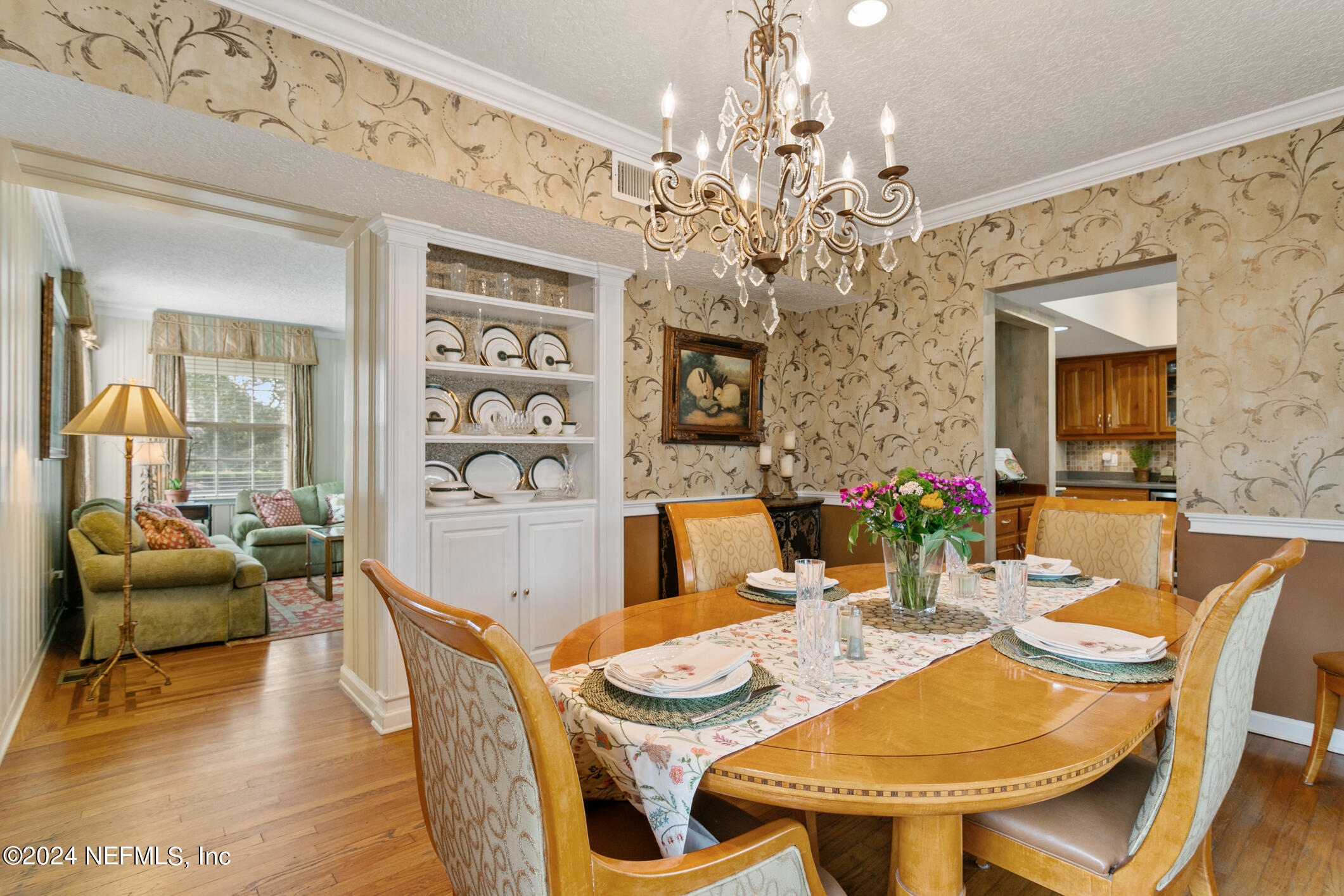 1111 Greenridge Road Jacksonville, FL 32207 - Photo 21 of 73 a view of a dining room with furniture and a chandelier