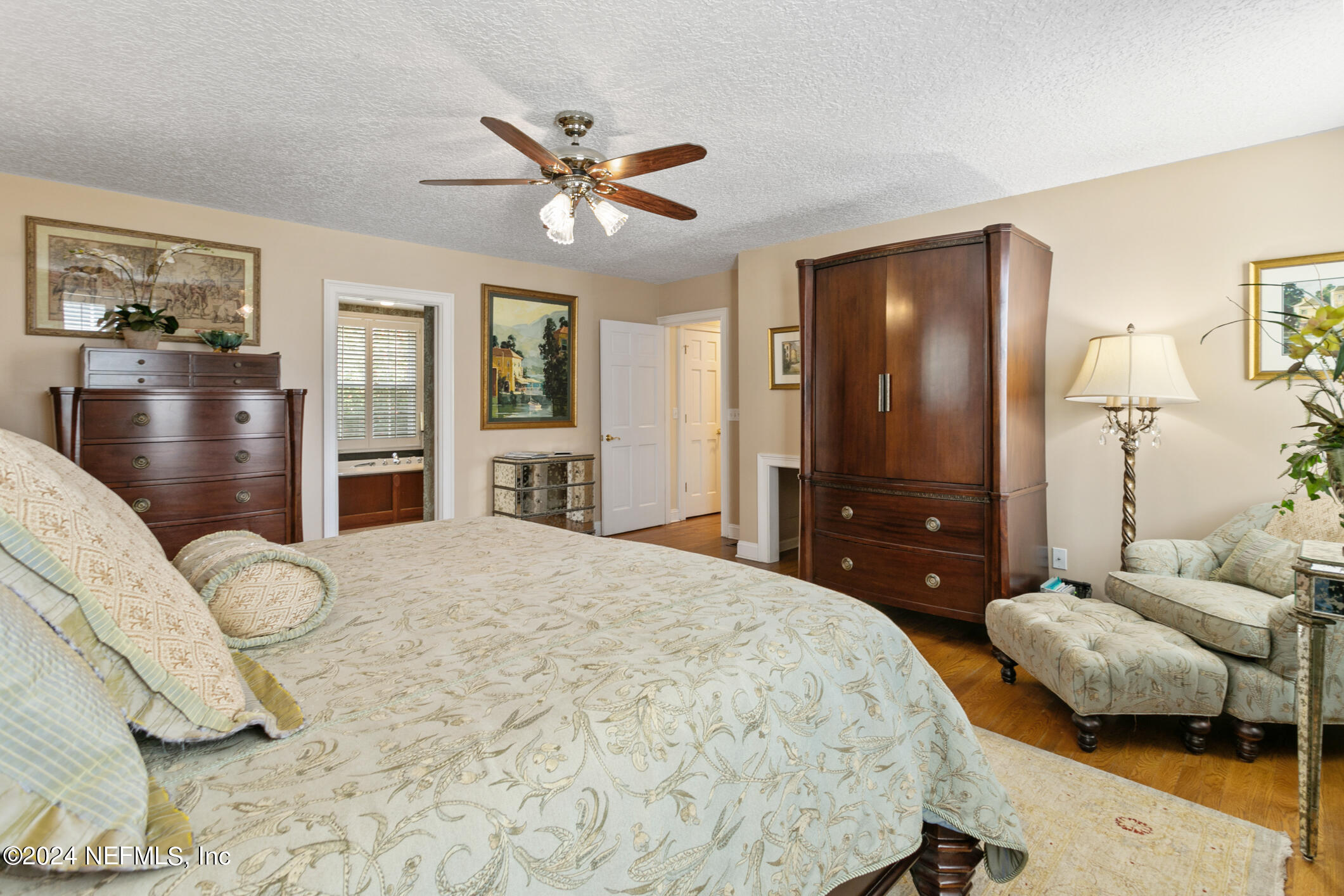 1111 Greenridge Road Jacksonville, FL 32207 - Photo 28 of 73 a bedroom with a bed and a flat screen tv