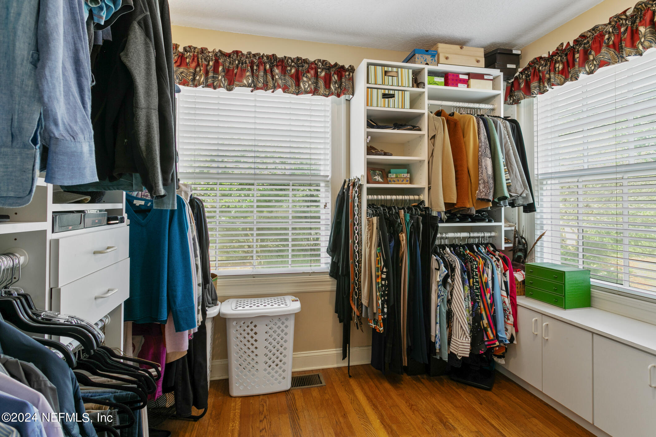 1111 Greenridge Road Jacksonville, FL 32207 - Photo 32 of 73 a view of walk in closet with clothes