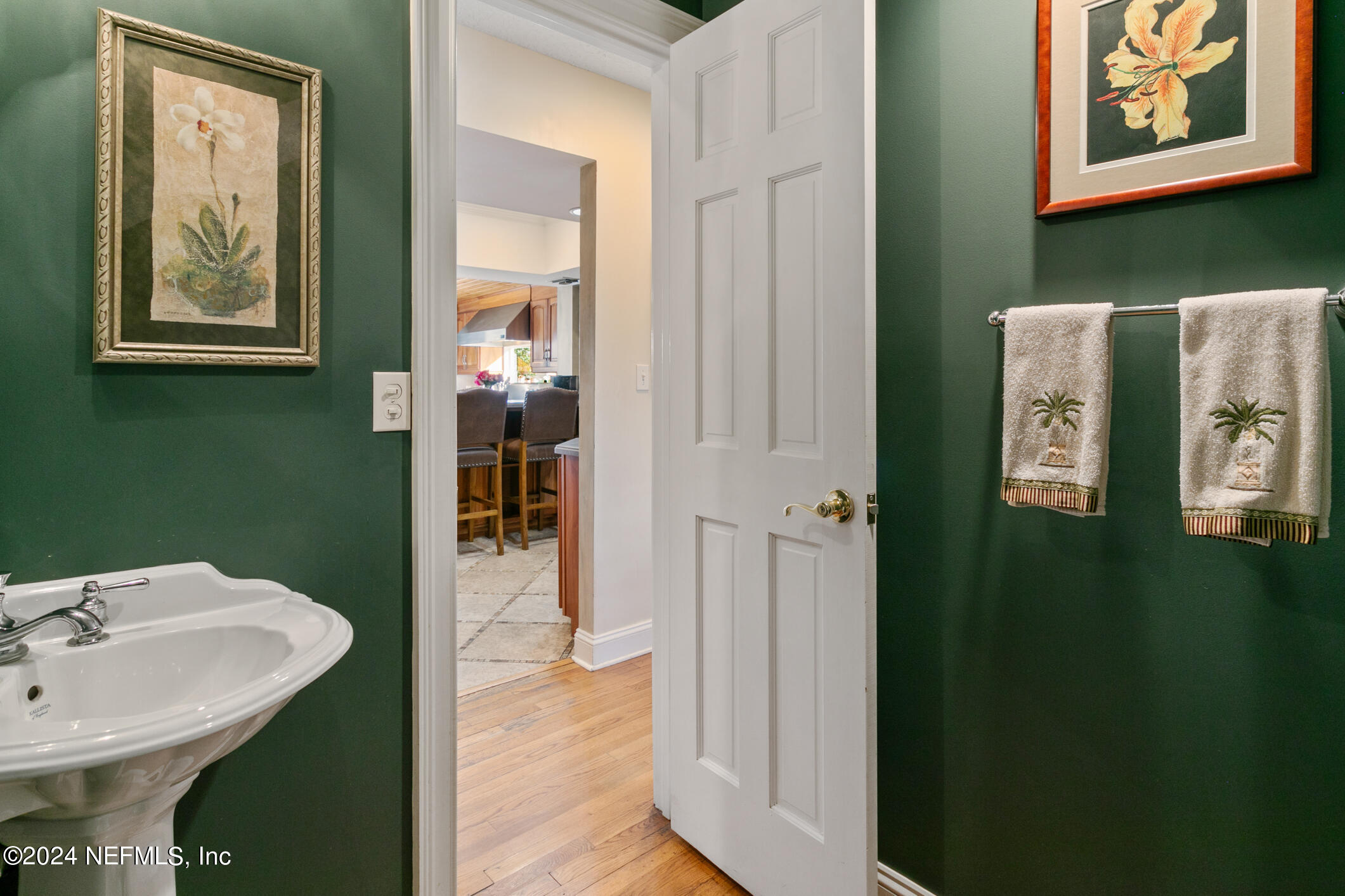 1111 Greenridge Road Jacksonville, FL 32207 - Photo 33 of 73 a bathroom with a sink and a mirror