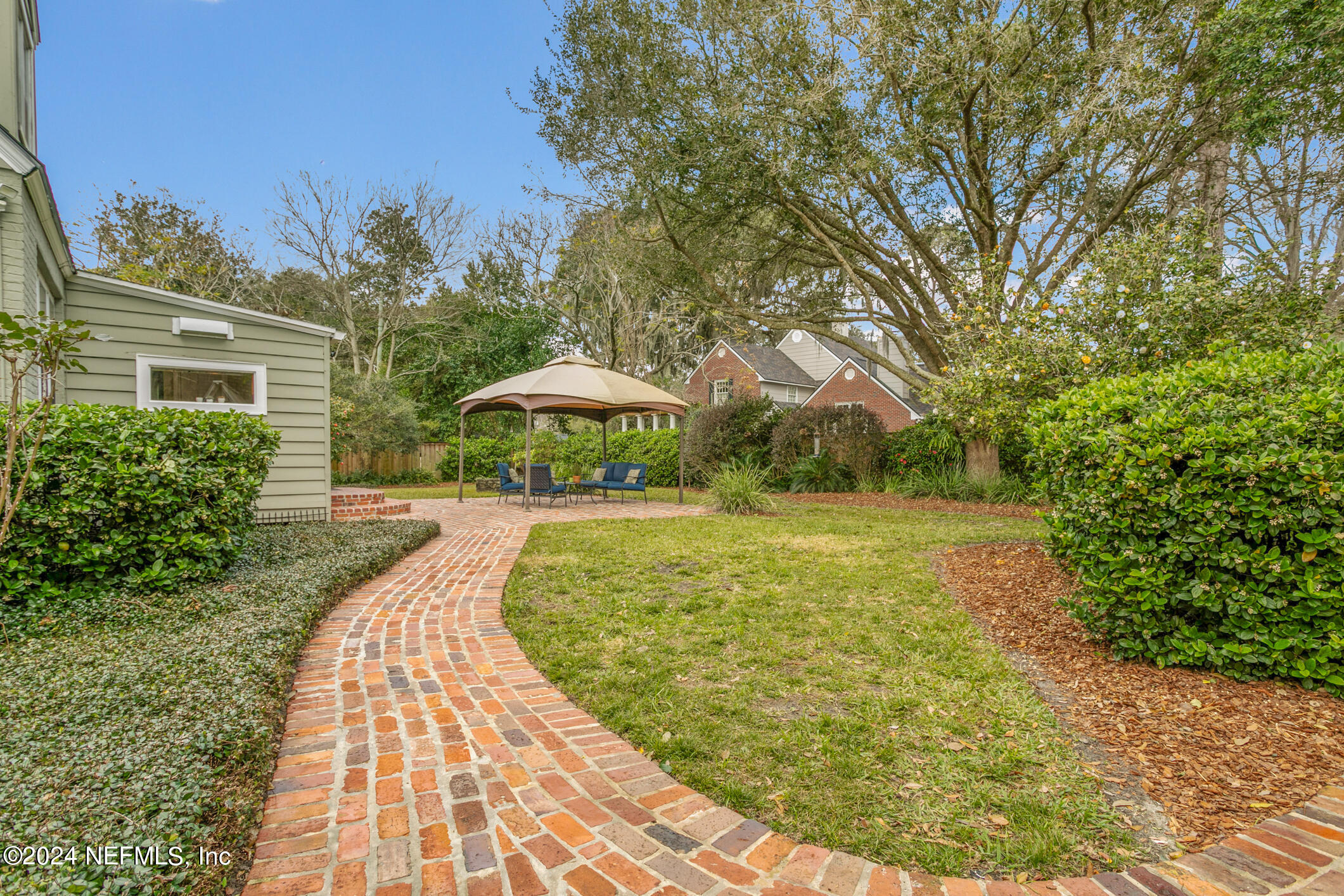 1111 Greenridge Road Jacksonville, FL 32207 - Photo 49 of 73 a view of a swimming pool with a patio