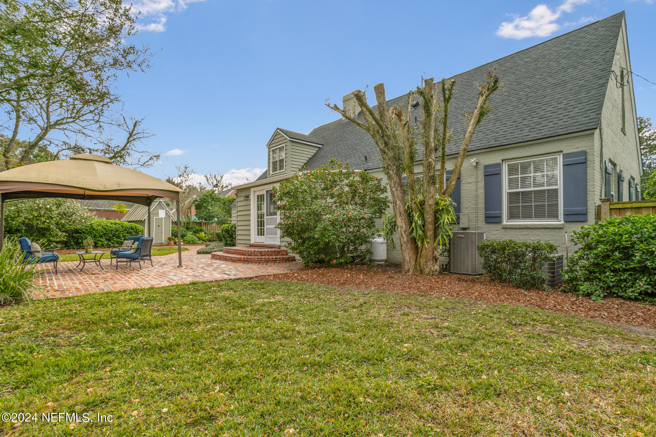 1111 Greenridge Road Jacksonville, FL 32207 - Photo 52 of 73 a view of a house with backyard and sitting area