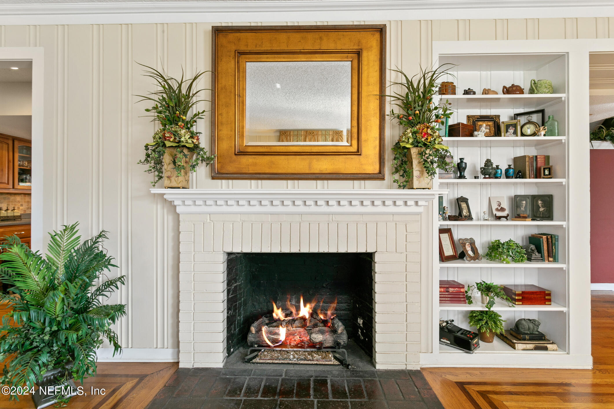1111 Greenridge Road Jacksonville, FL 32207 - Photo 55 of 73 a living room with a fireplace and a potted plant