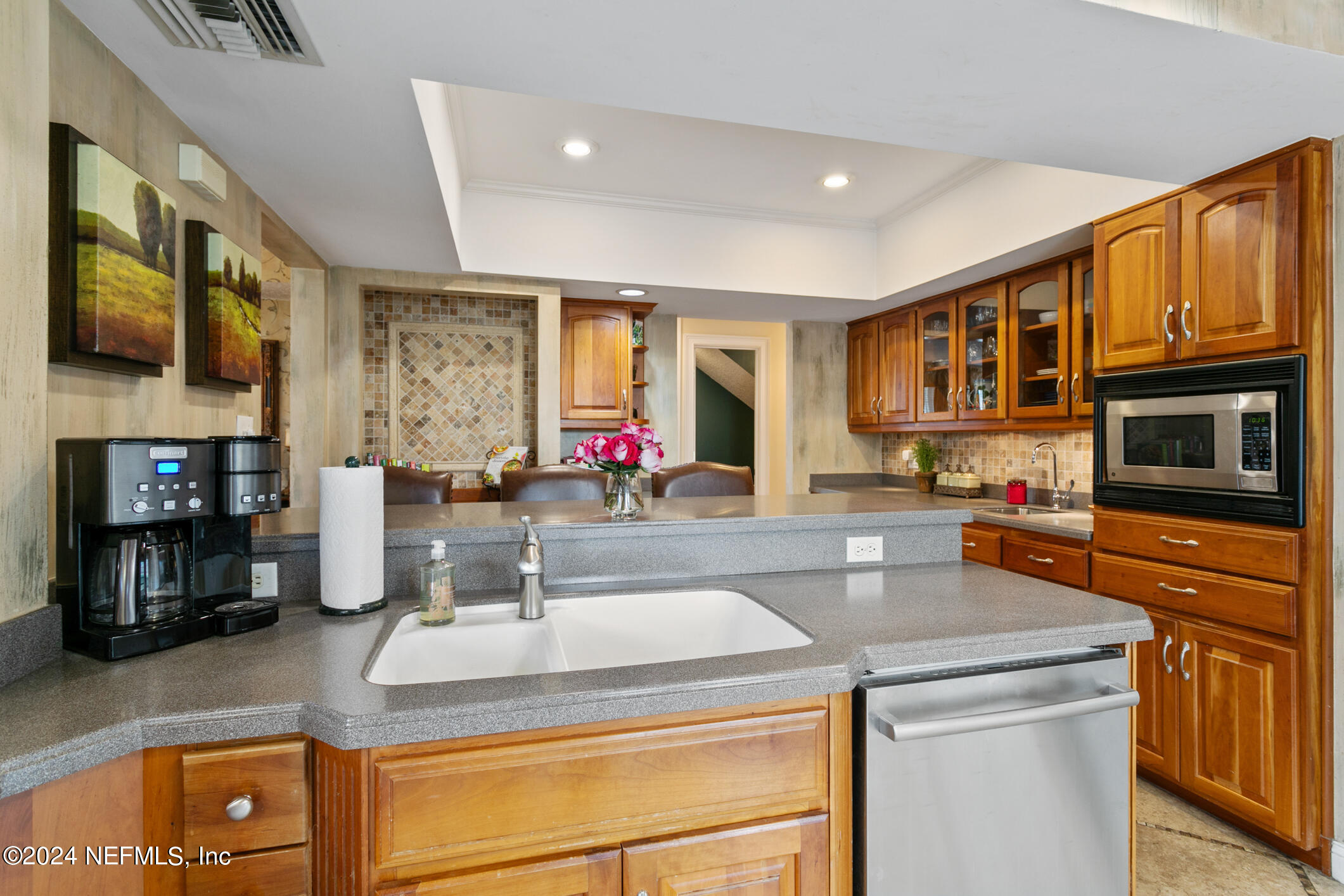 1111 Greenridge Road Jacksonville, FL 32207 - Photo 58 of 73 a kitchen with stainless steel appliances granite countertop a stove and a sink