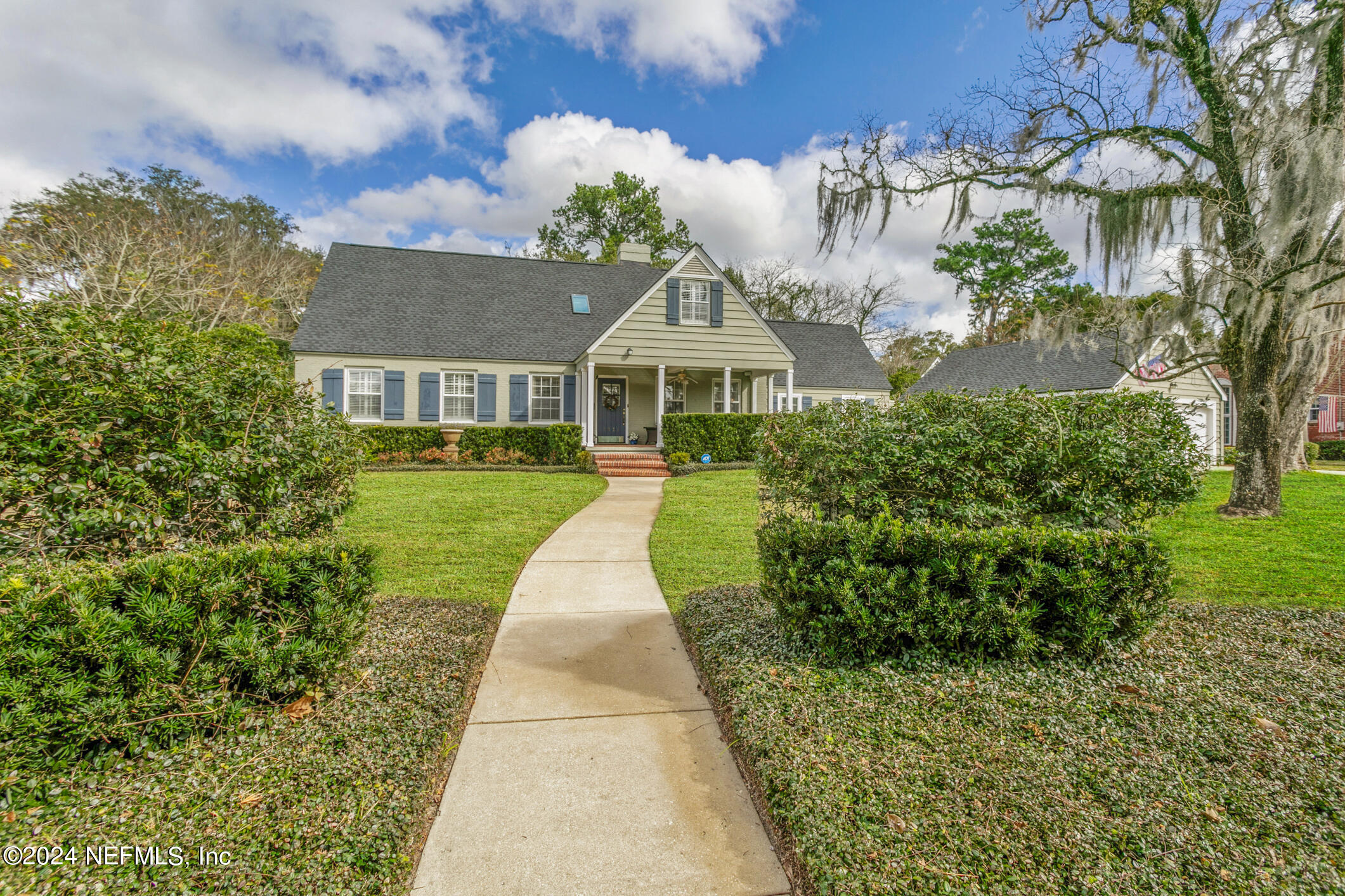 1111 Greenridge Road Jacksonville, FL 32207 - Photo 71 of 73 a front view of a house with a yard and potted plants